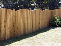 <b>Convex Arched Board and Batten Wood Privacy Fence with French Gothic Posts</b>